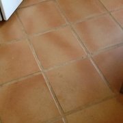 Kitchen floor before and after cleaning.