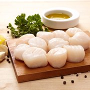 scallops and garlic on a cutting board