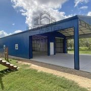 30x60x12 All vertical sided Utility Building with a 30x20 covered area and 30x40 enclosed garage area.