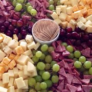 Assorted cheese, meat, & fruit appetizer platter