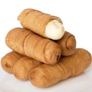 Tequeños - a generous piece of white cheese wrapped in a thin dough, soft in the inside but crunchy in the outside.