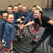 Teacher Tomi getting the Juniors ready for the stage!
