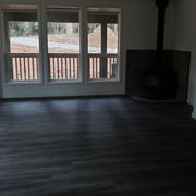 We added a wood stove and closed off the front pass through from the front door.