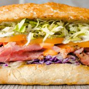a sandwich with meat and vegetables