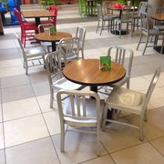 Food court has both adult size tables and kids size tables
