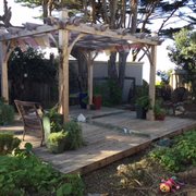 custom pergola and deck with meditation crystals