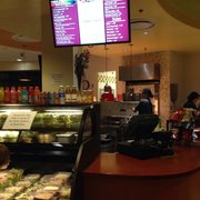 a woman ordering food at the counter