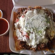 Chicken nachos with side of red sauce. Soooo good!!!