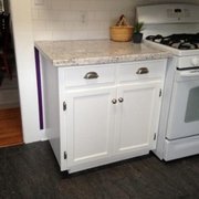 a kitchen with white cabinets