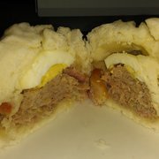 a half eaten sandwich on a plate