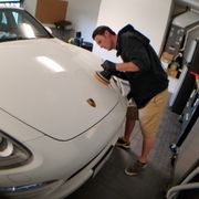 Owner and Founder Derek lay Detailing a Porsche