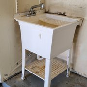 This prep sink in the garage is in need of replacement.