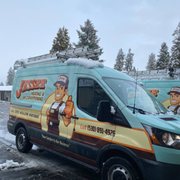 Jessee Heating and Air van covered in snow
