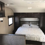 2018 Forest River Grey Wolf Trailer Queen Bed with a pillow top mattress.