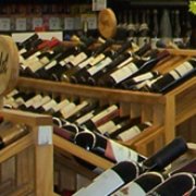 rows of wine bottles in a store
