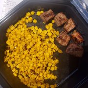 Canned mushy corn, and dog food? Both cold and disgusting! Not to mention this is the FULL serving of steak bites. Save your money!!