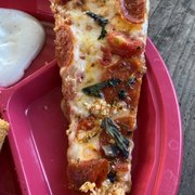 Pepperoni, basil, and garlic pizza
