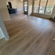 a living room with hardwood floors