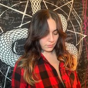 Wolf layered cut curtain bangs and blow out .