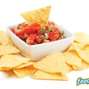 a bowl of salsa with tortilla chips