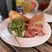 Burrata with snap peas and prosciutto