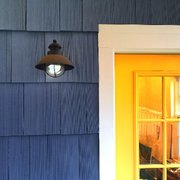a blue house with a yellow door