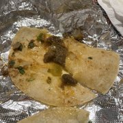 two tortillas on a foil wrap
