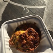 a take out container with a meal in it
