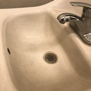 This sink is white on the sides and brown on the face