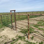 Pipe fence with sucker rod