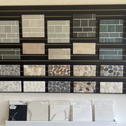 backsplash tile and a wide selection of quartz/granite countertops.