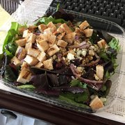 Spring greens with chicken, cranberries, blue cheese, walnuts, and red onion