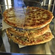 By the Slice - Huge slices 5$ - Always a great selection available of our specialty pizzas.