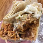 Chicken burrito with cheese and sour cream.