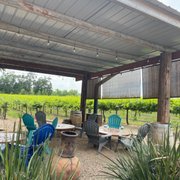 a patio with chairs and tables