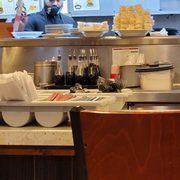 Cooks not wearing masks correctly while  oozing food
