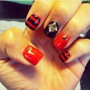 Red & black gel with gold studs.