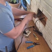 Dominic fixing the customers equipment.