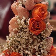 a bouquet of roses and seashells