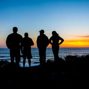 Enjoying a sunset during a sea kayaking trip