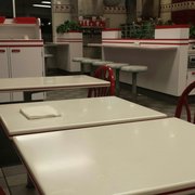 Lots of seating, tables, booths, and counter top stools