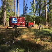 One of our red vans fixiing plumbing and clearing drains up in the Paradise and Magalia area.