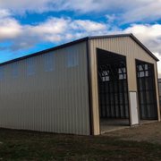 30x50x16 RV Garage with two 12x14 garage doors and skylights in the walls