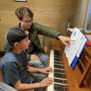 Our Instructor Jacob helping piano student Weston Anderson