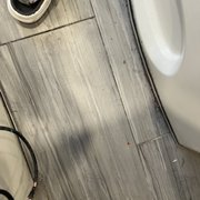 The floor next to the pedicure chairs.