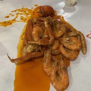a large pile of cooked shrimp
