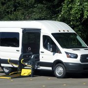 Full Size Transit w/ ADA Side Lift w/ up to 9 passenger seat capacity & up to 3 wheelchair positions.