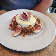 Goat Cheesecake with fig and granola.