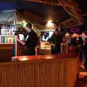 a man standing at the bar