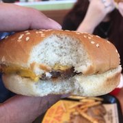 a person eating a hamburger